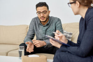 Adult man consulting with ABA therapist