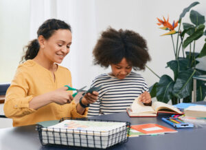 Autistic girl working with ABA therapist