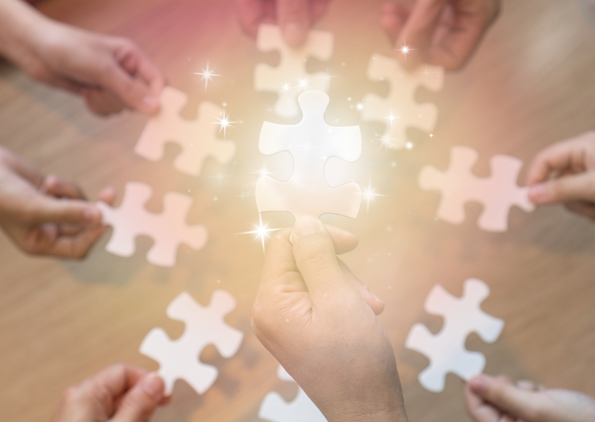 hands holding pieces of jigsaw as a symbol for ASD