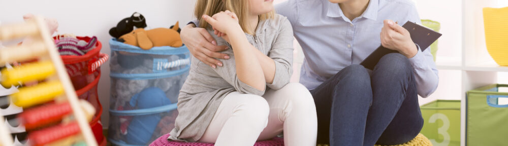 ABA therapist in a playroom