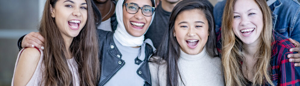 Group of multicultural interns smiling at the camera