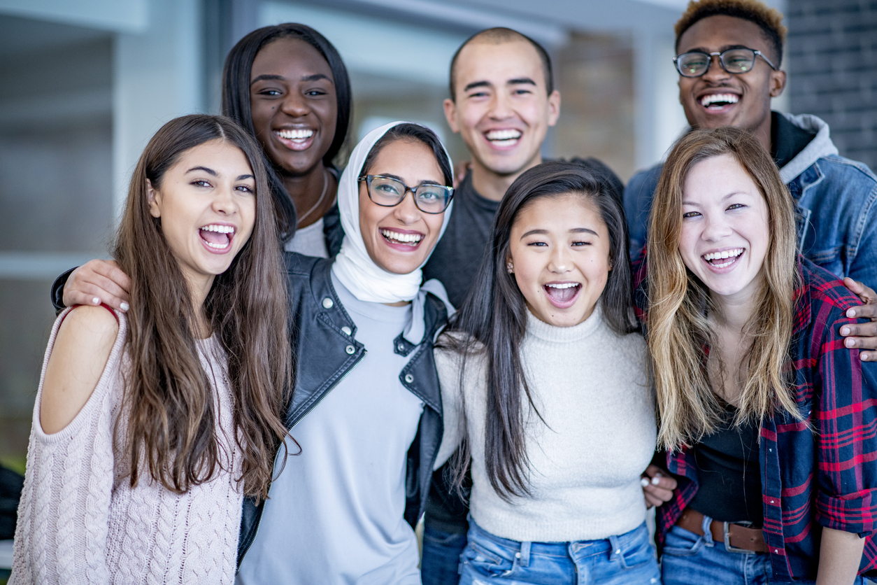 Group of multicultural interns smiling at the camera