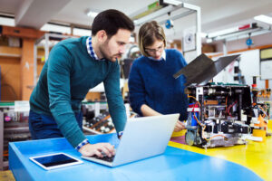 robotics student working with teacher
